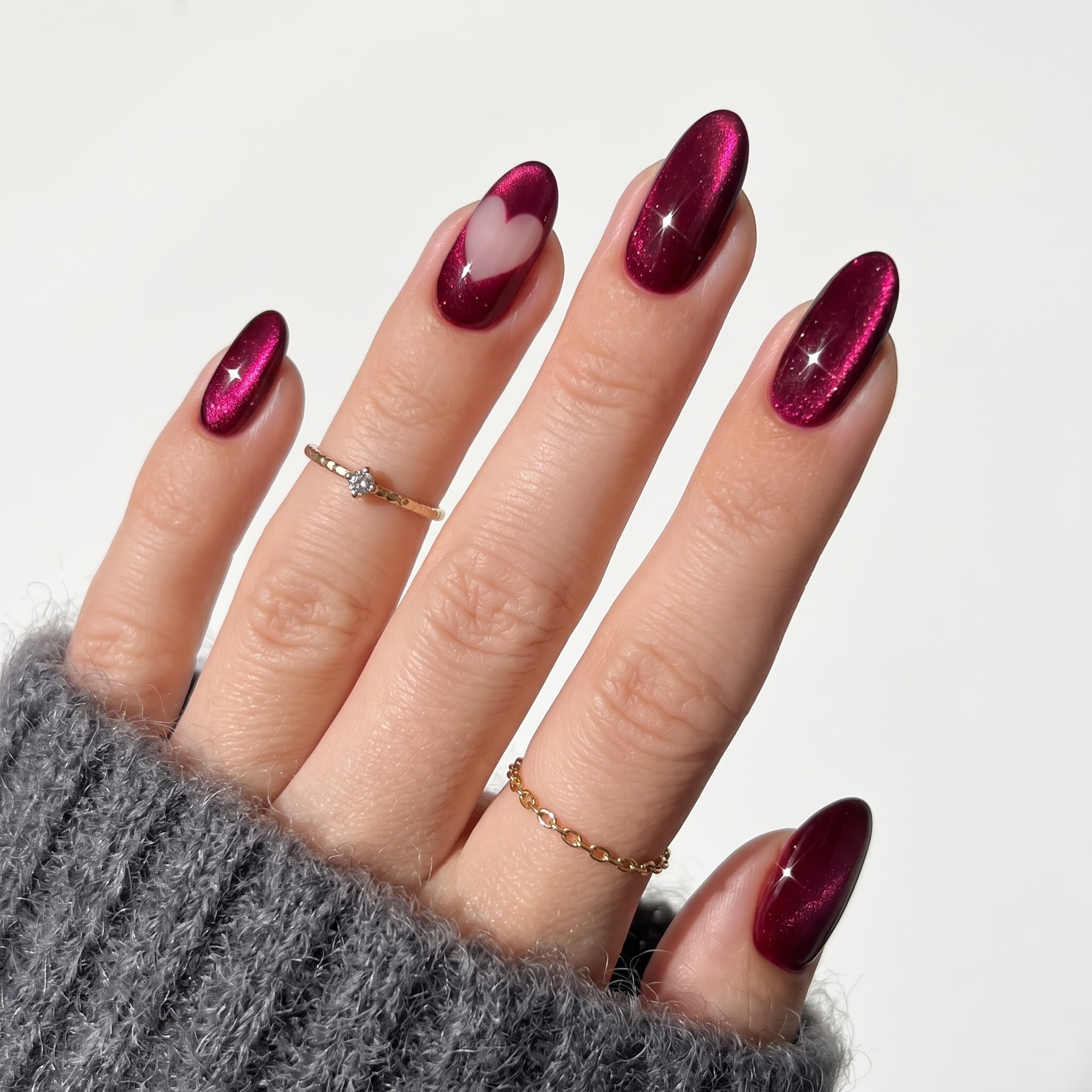 Dark pink magnetic nails with deep glossy shimmer