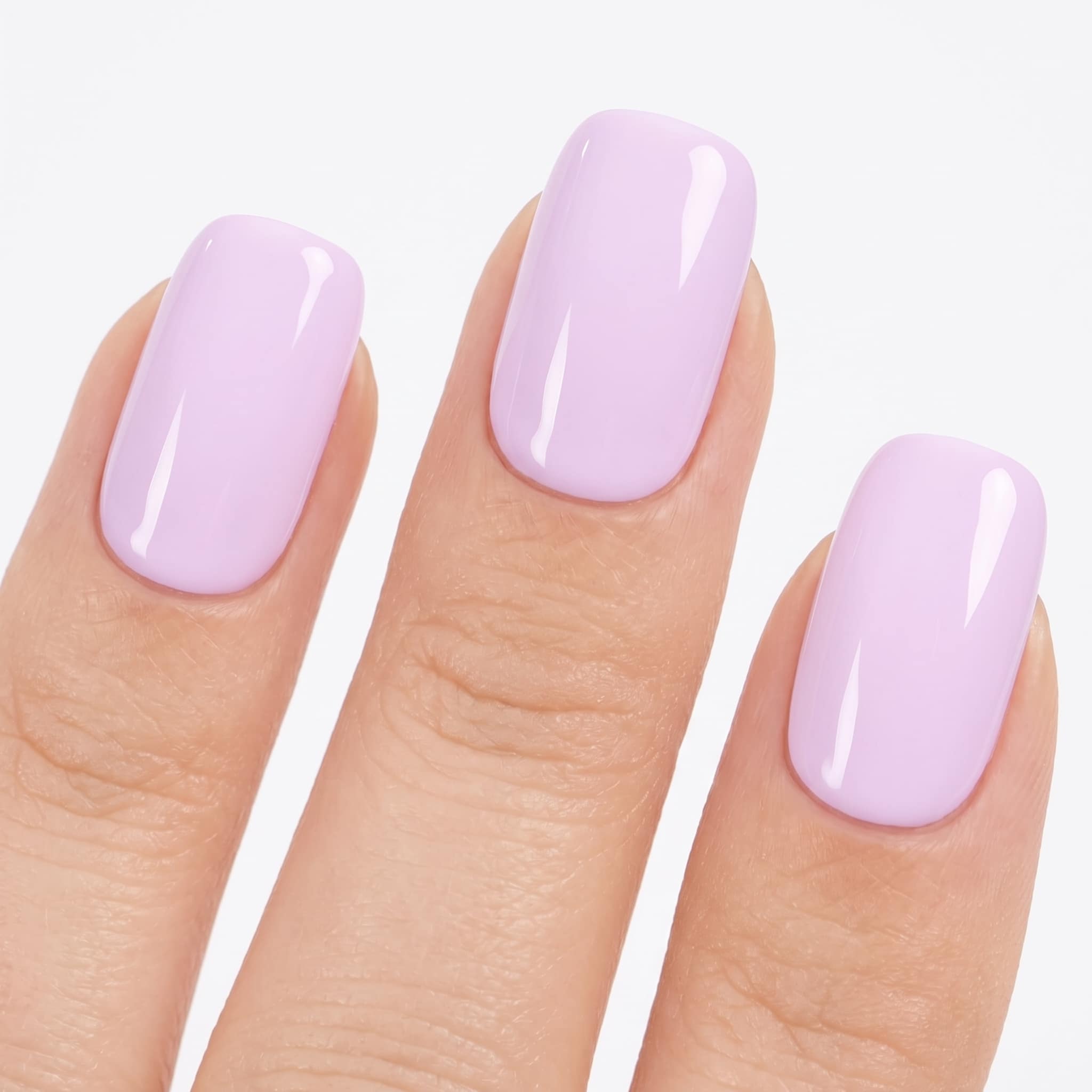 Long almond nails with a soft glossy light pink finish