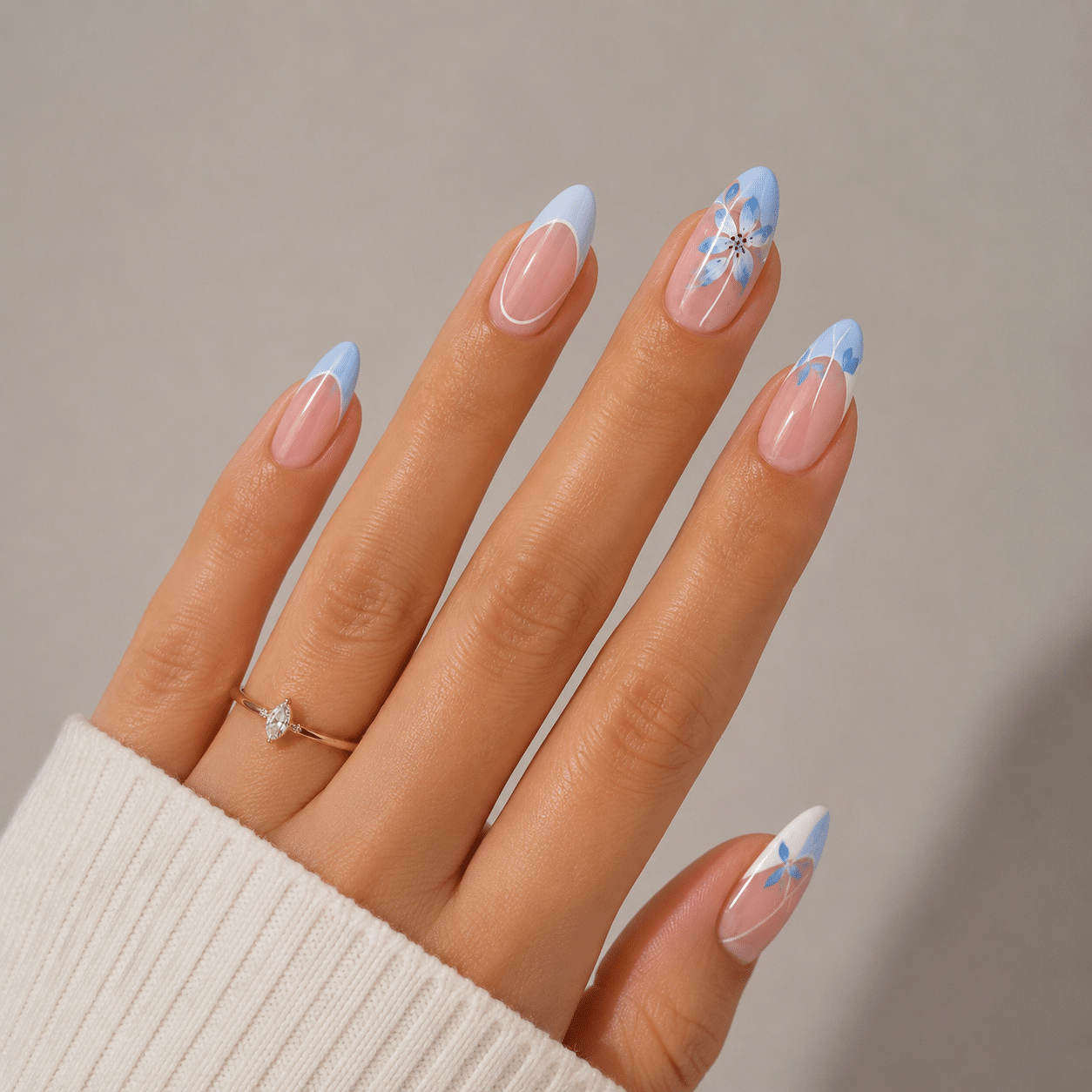 Nail designs with soft blue and white details on a glossy manicure