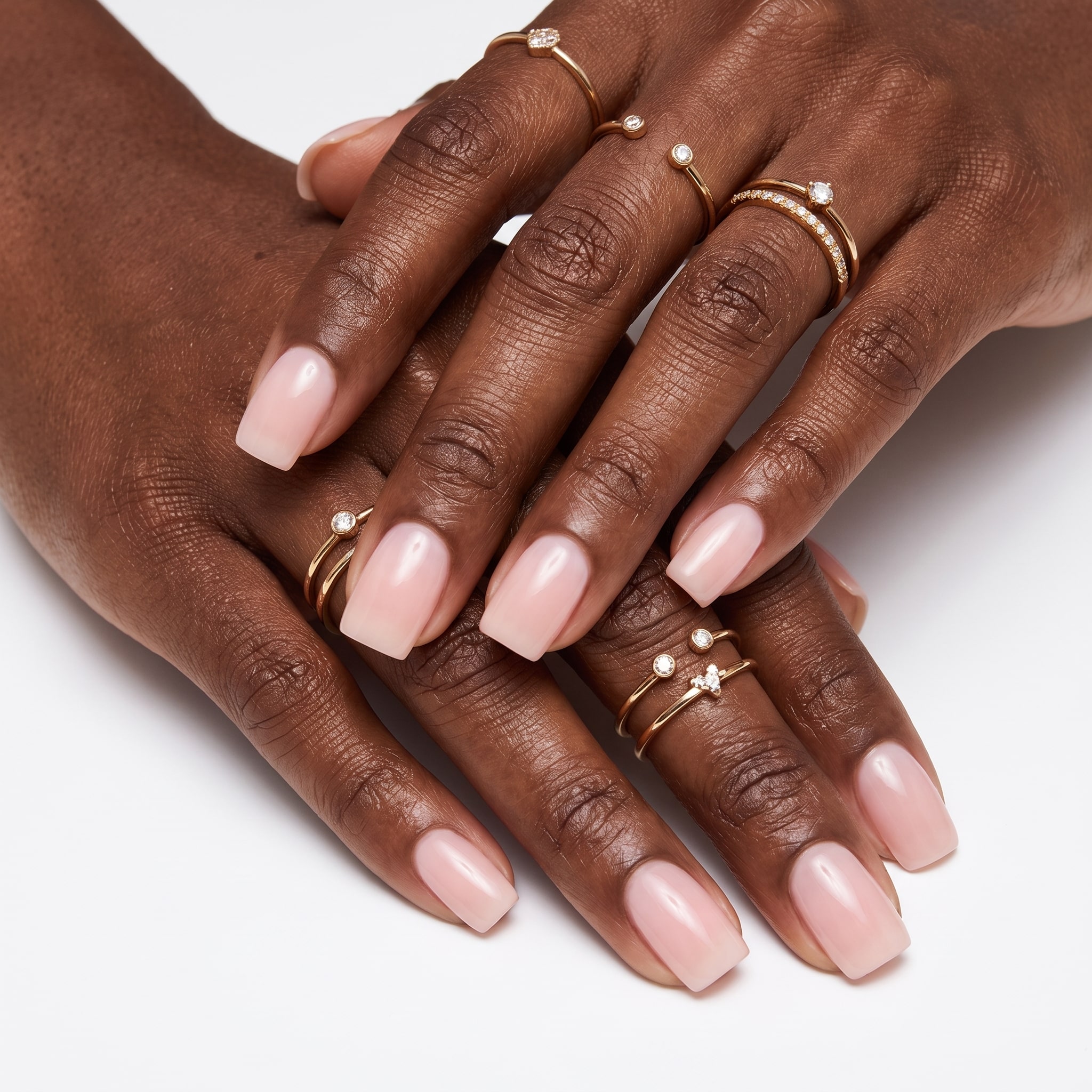 Warm peachy blush nail polish on natural short nails