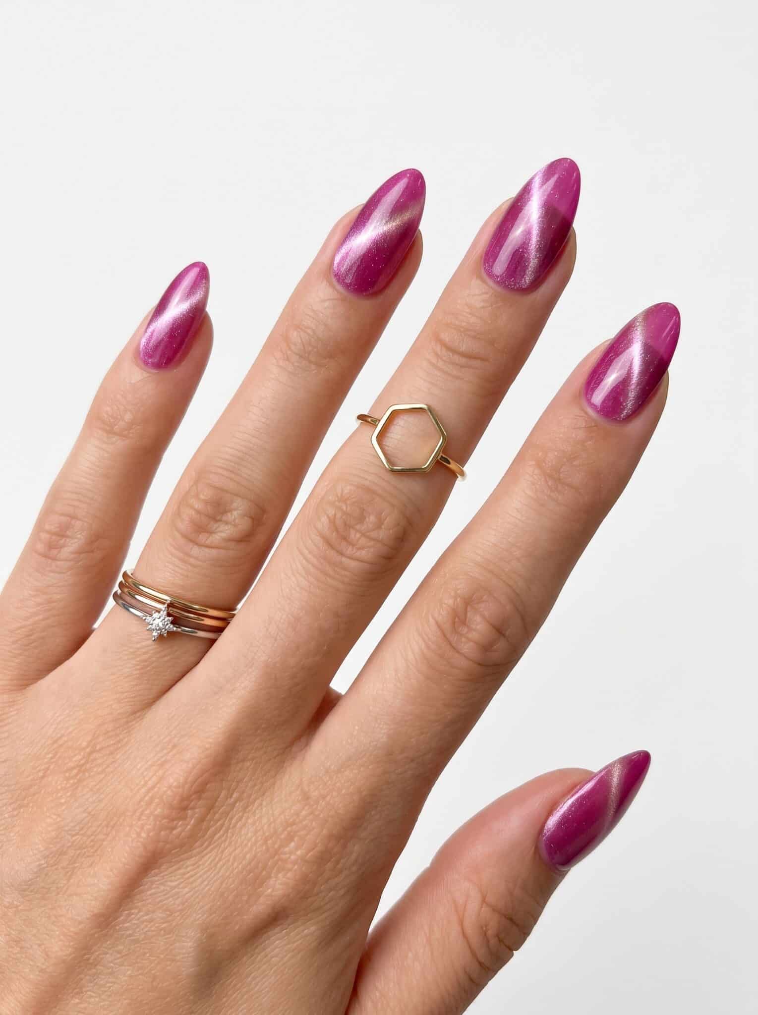 Pearl pink almond nails with a luminous magnetic shimmer