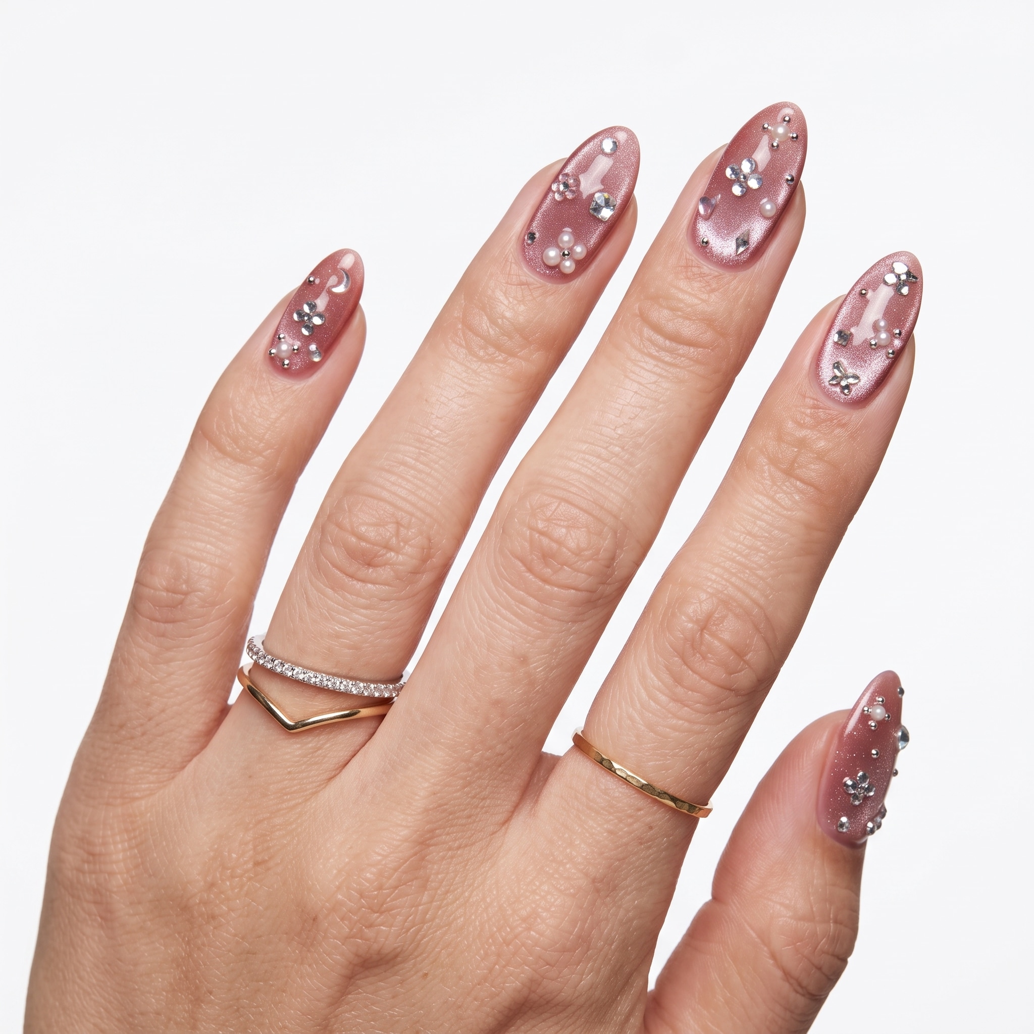 Glossy pearl pink magnetic nails with a bright reflective cat-eye effect
