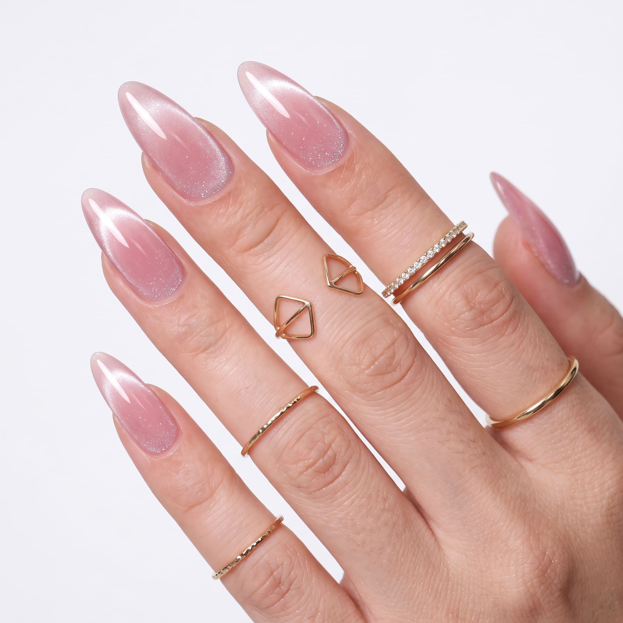 Pink magnetic nails with delicate speckled nail art details