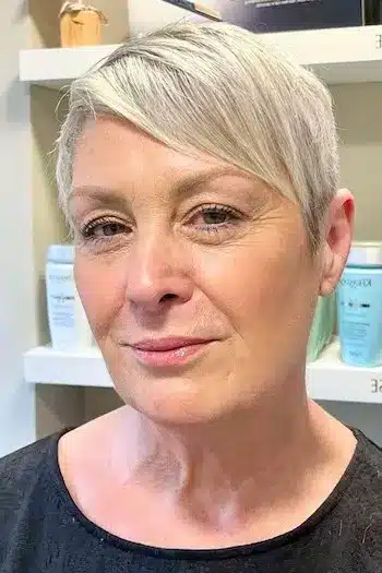 Short Hairstyles for Women Over 70 With Fine Hair - Silver Side-Swept Pixie with Tapered Sides Hairstyle