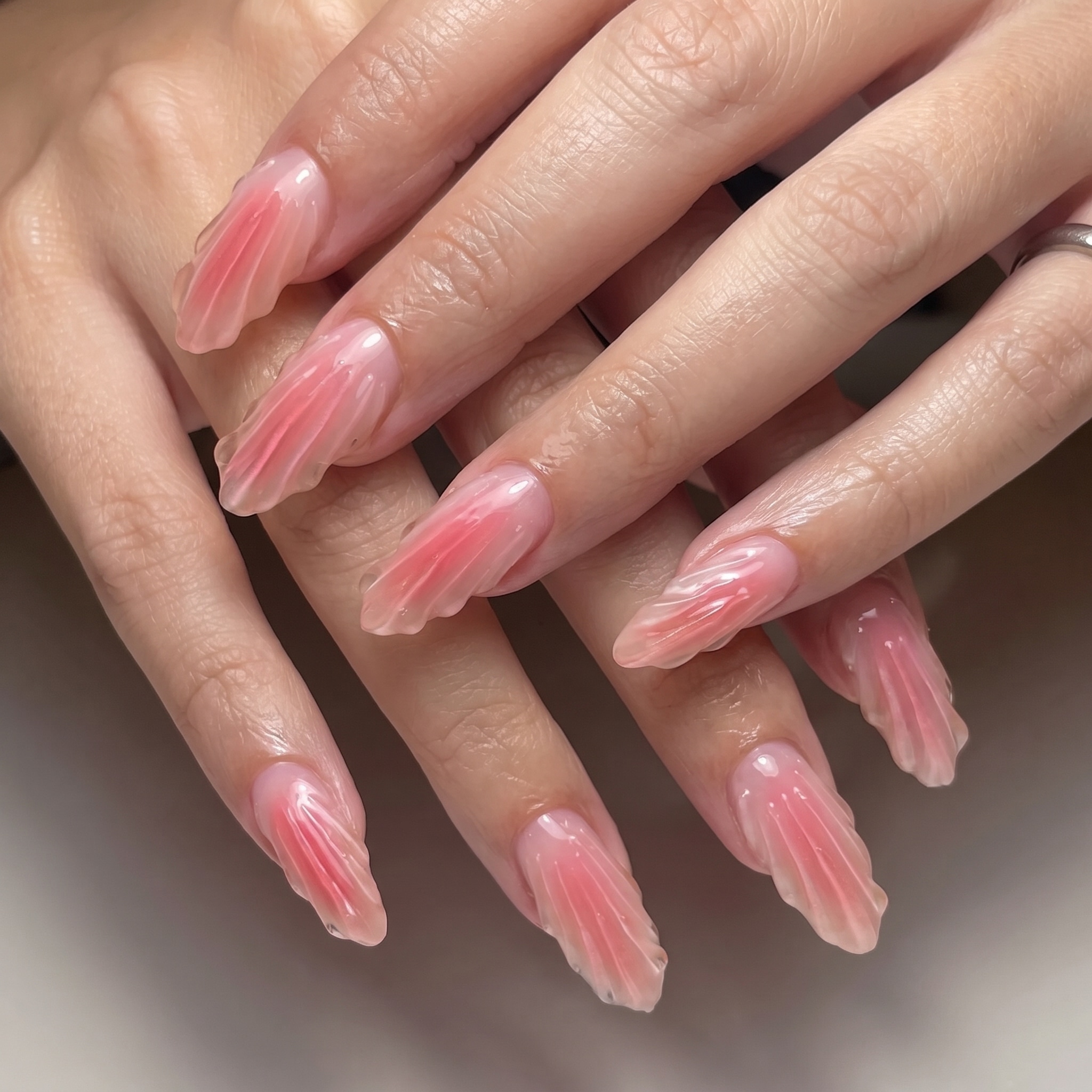 beach bits manicure with mismatched pink white shell and bubble details