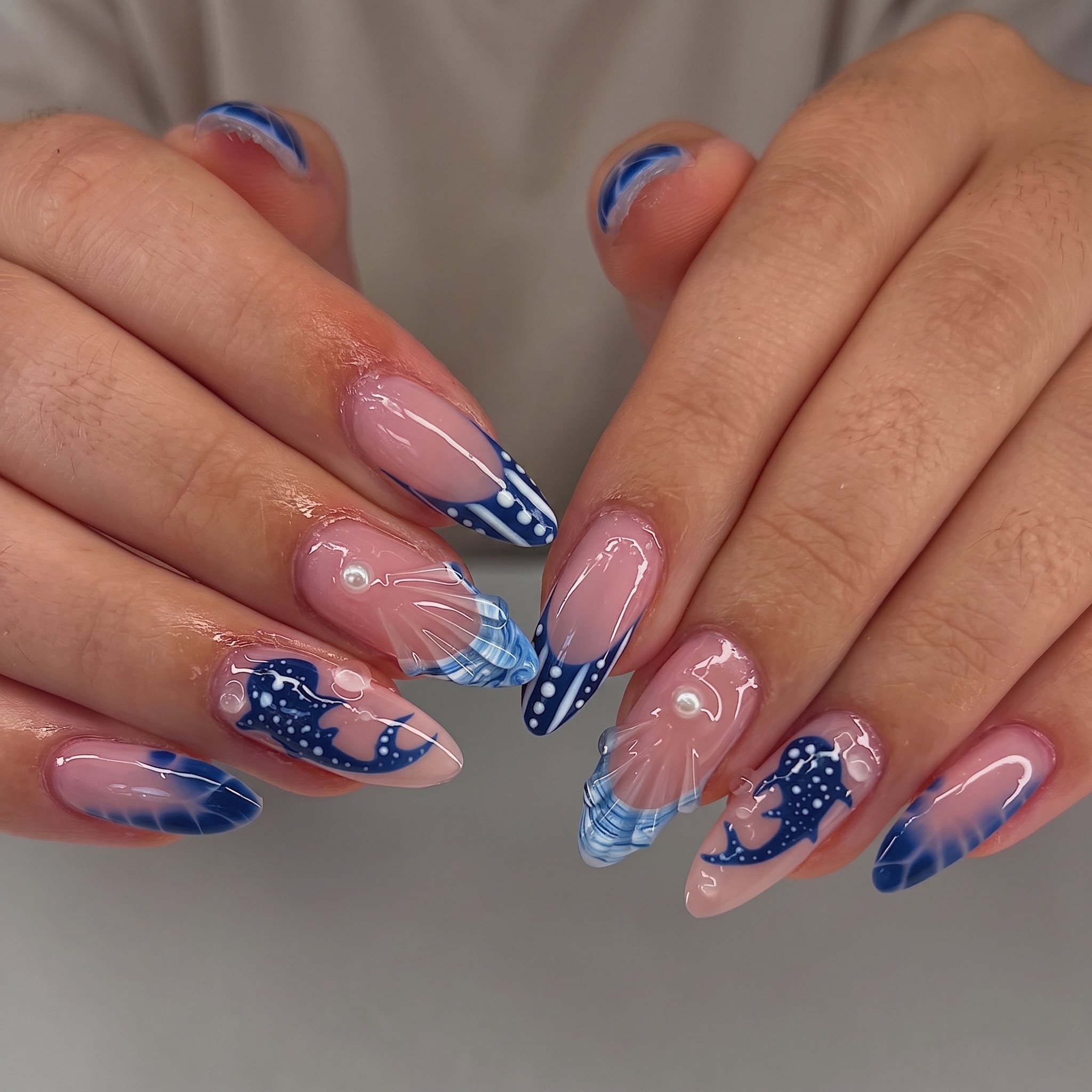 close up ocean accent nails with blue spotted shark pattern