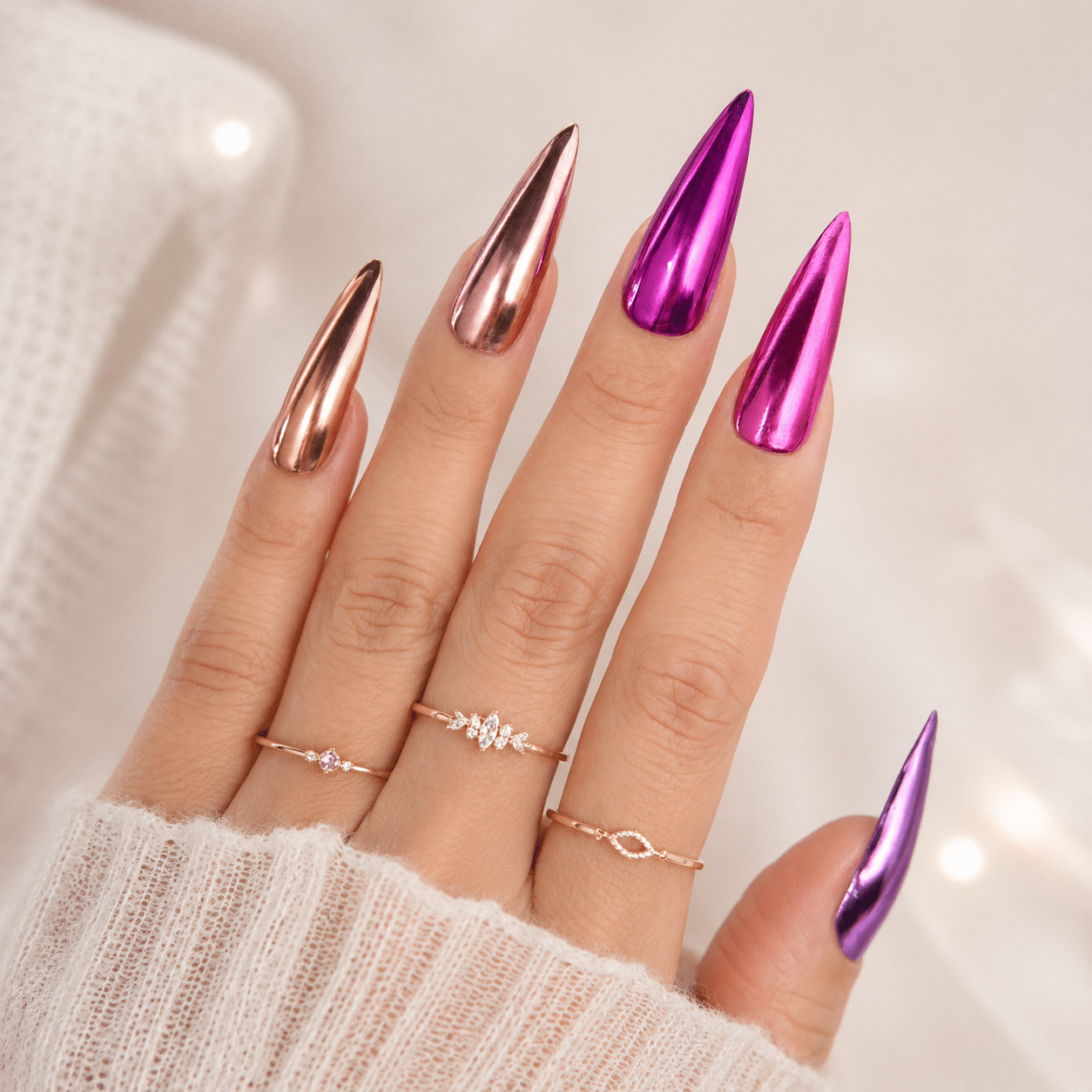 Fuchsia pink chrome nails with a bold mirror effect