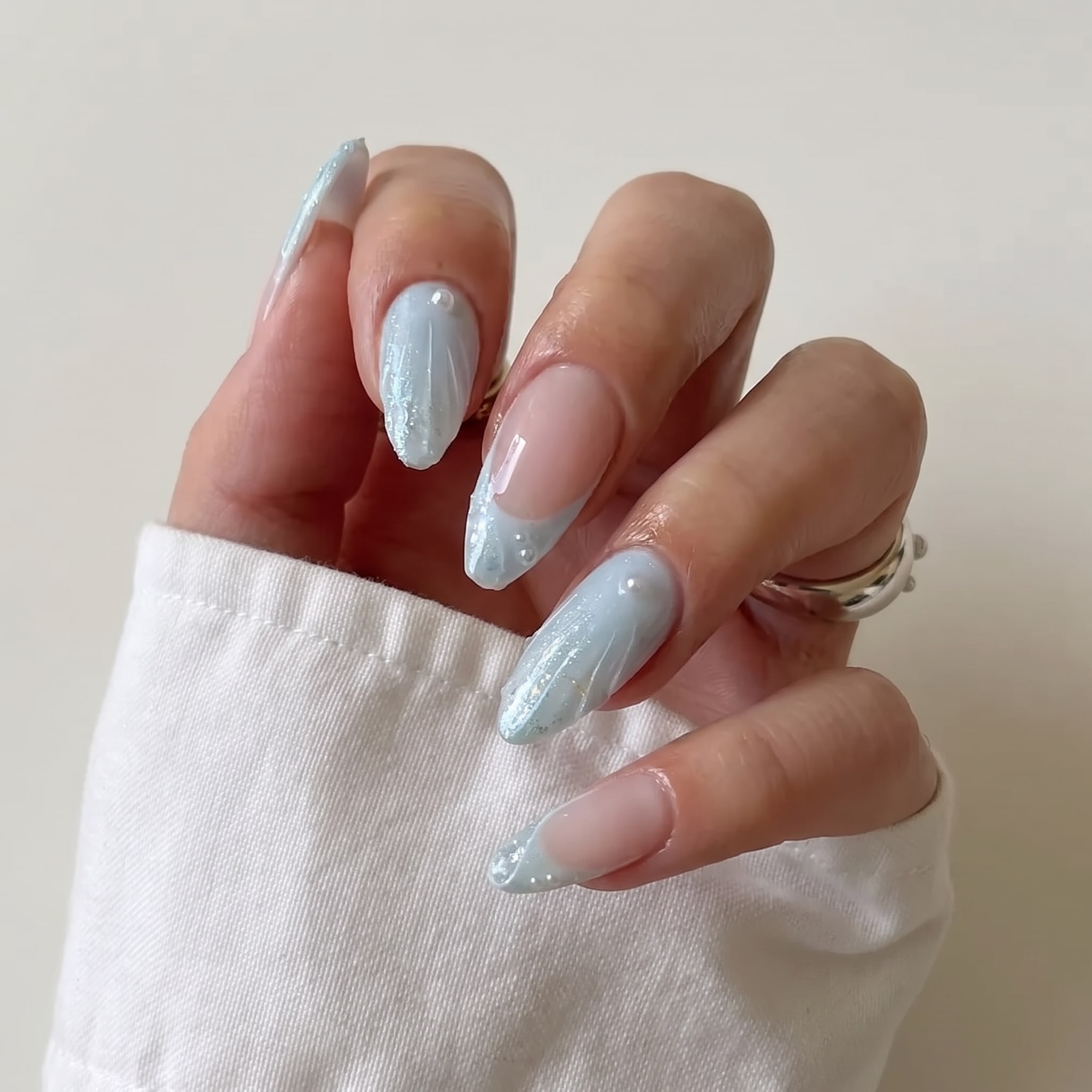 island girl manicure with pink shell details and tropical flower accent
