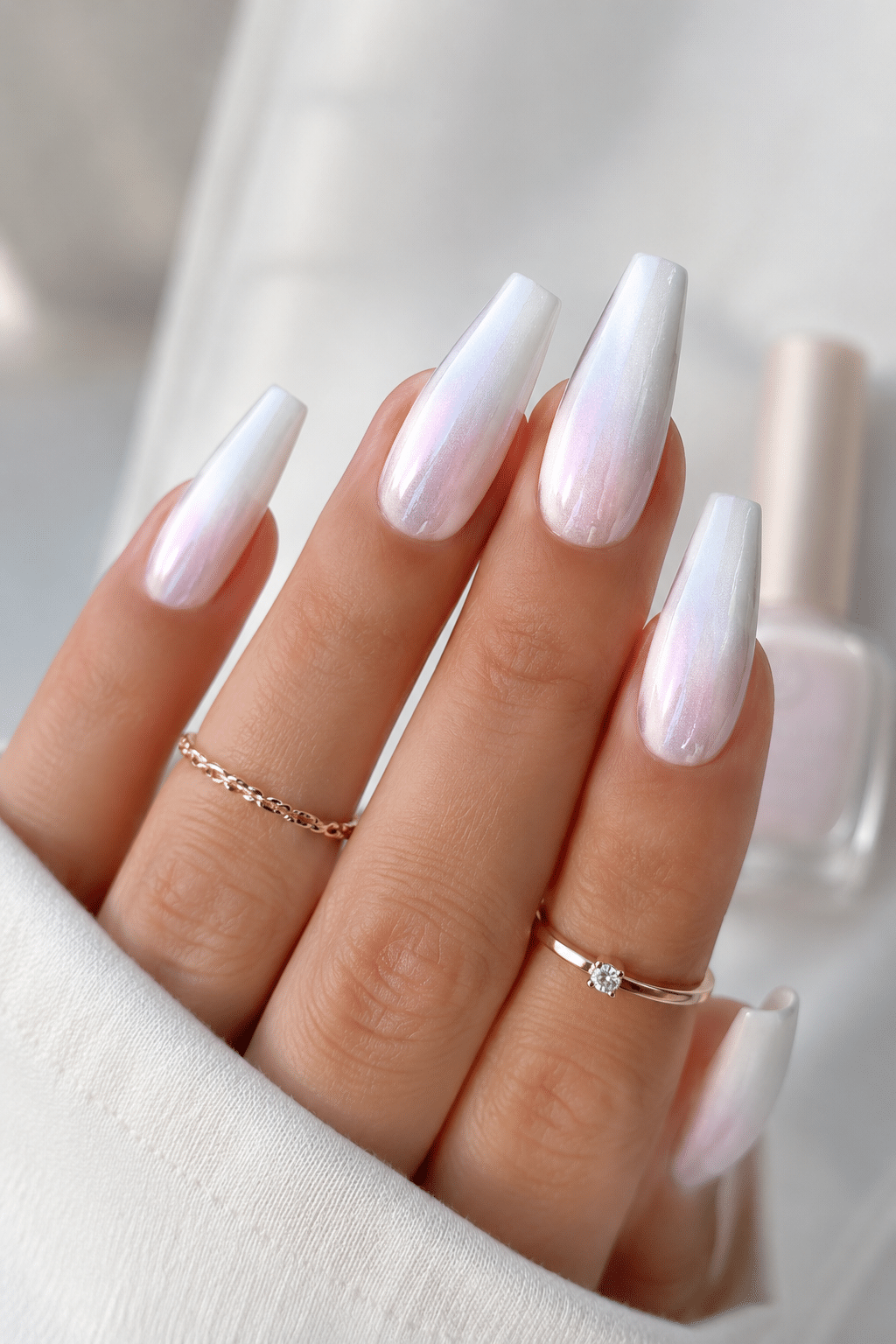 long pearl white almond nails with glossy luminous polish