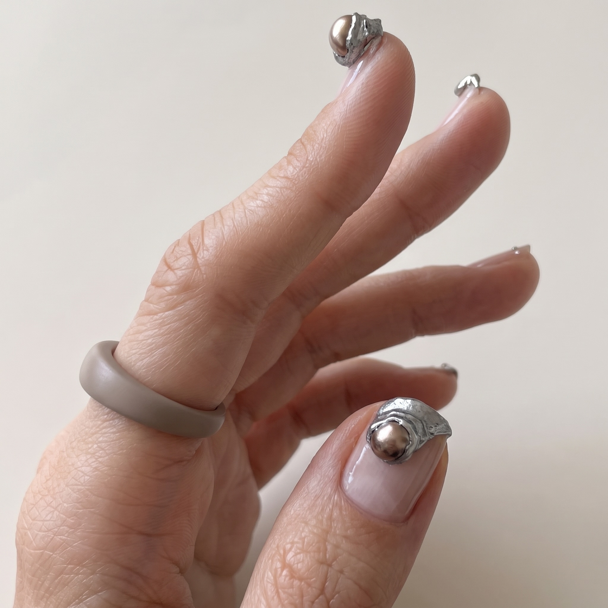neon sign manicure with holographic shell shine and prismatic coastal glow