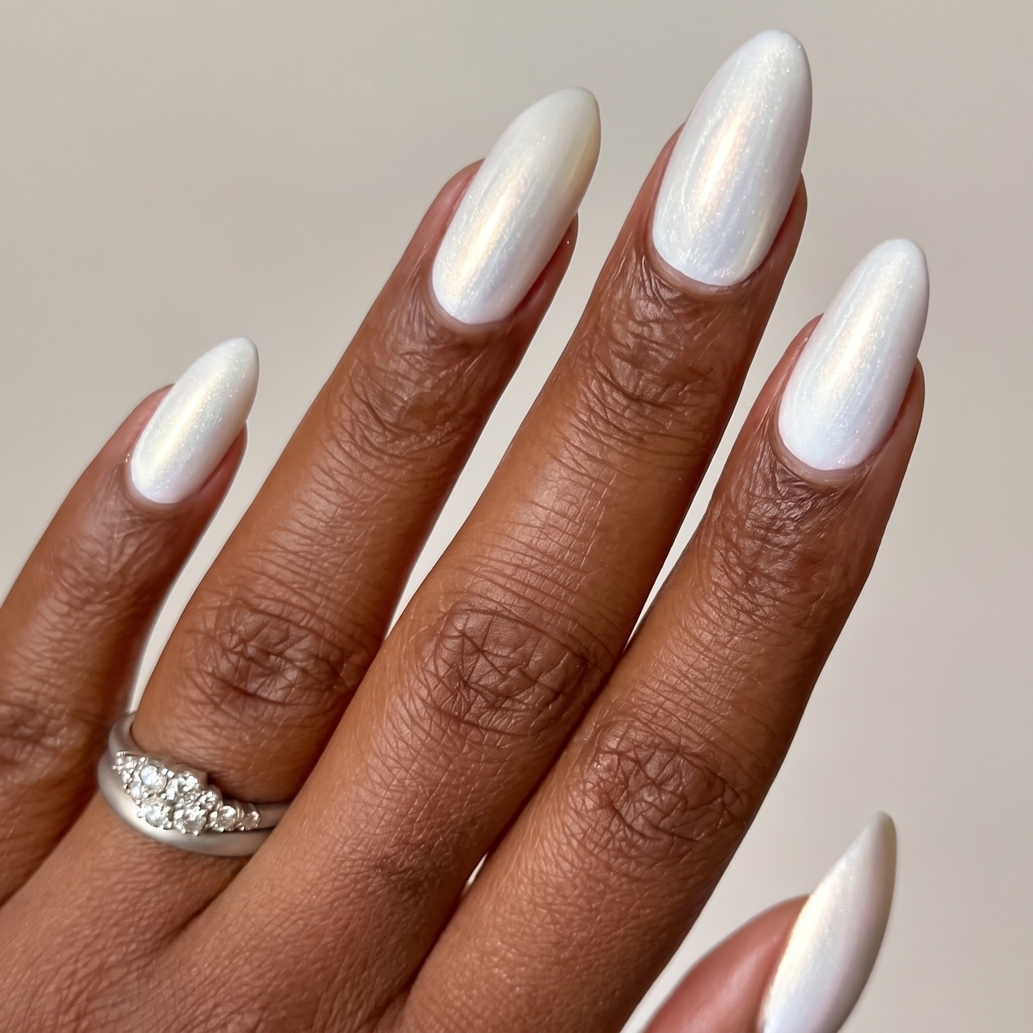 outer shell manicure with 3D shell charms and soft pearl bubble accents