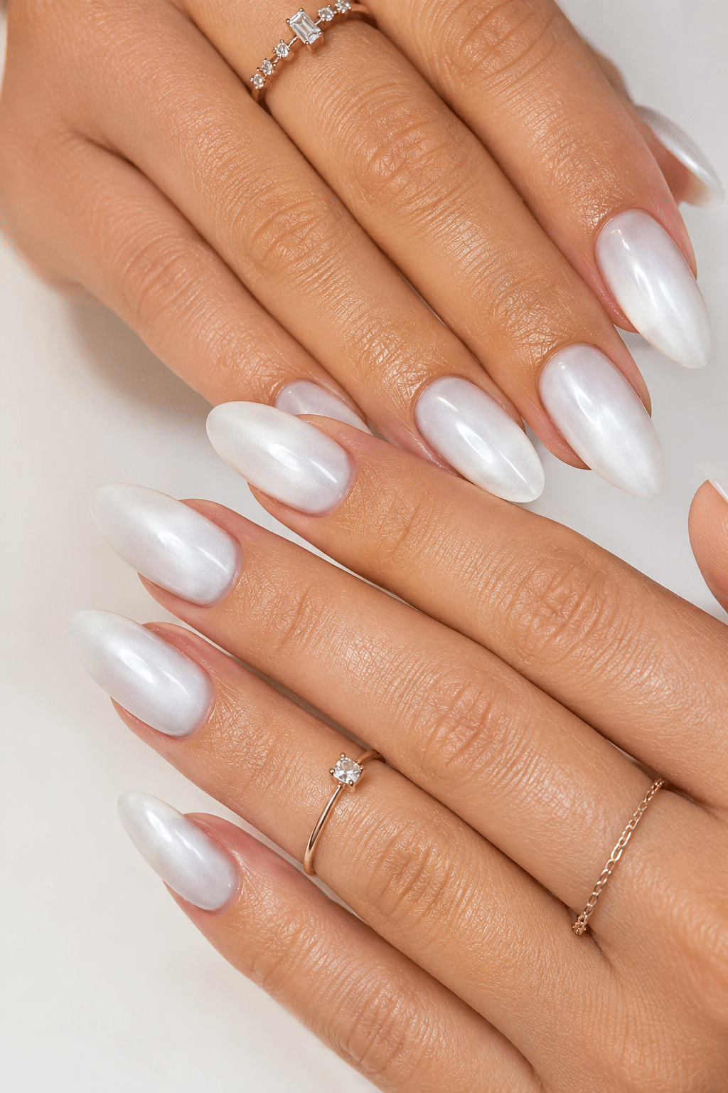 pearl white nail polish manicure with glossy luminous shimmer and clean white finish