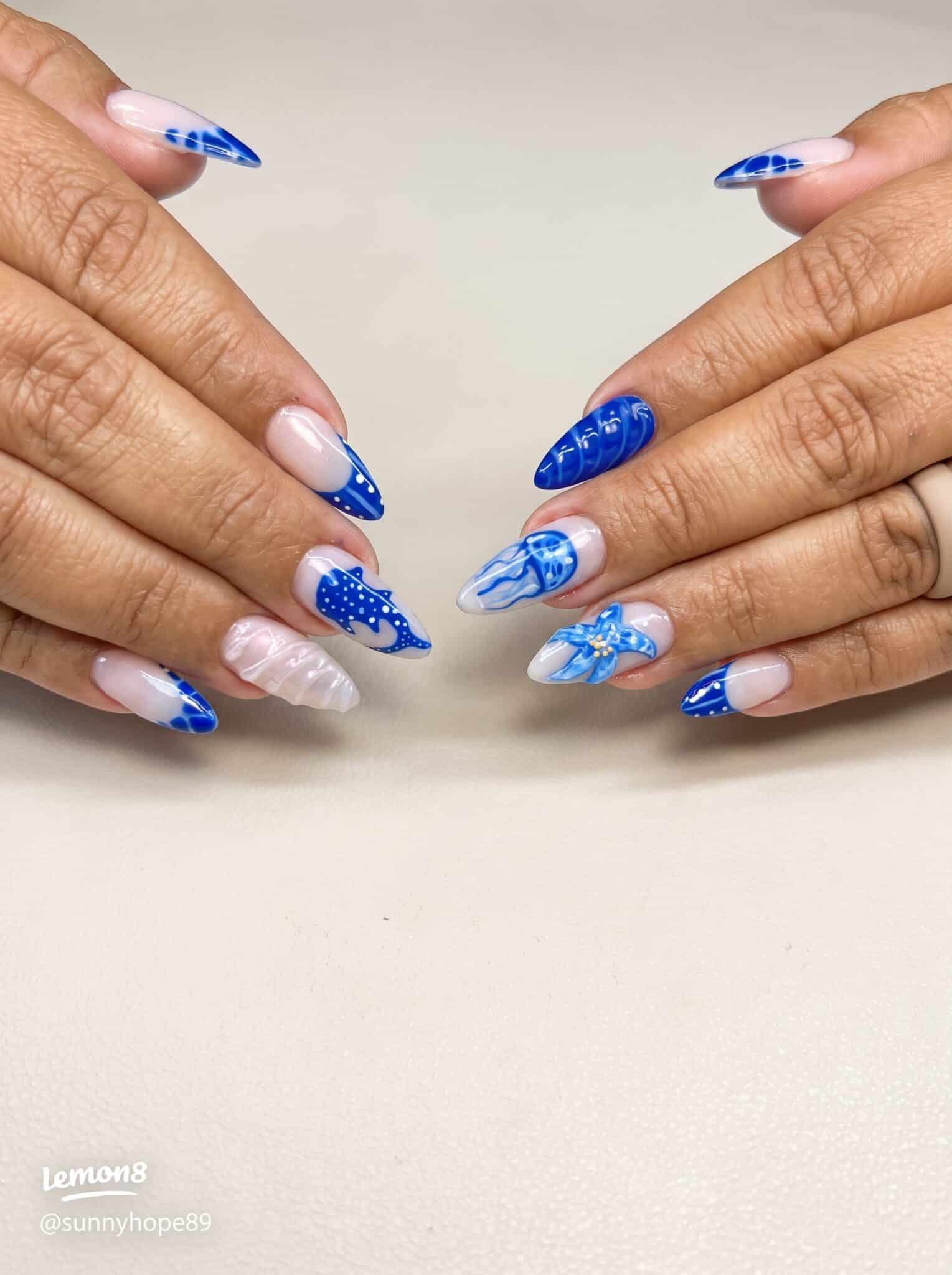 pink nude manicure with blue spotted ocean tip details