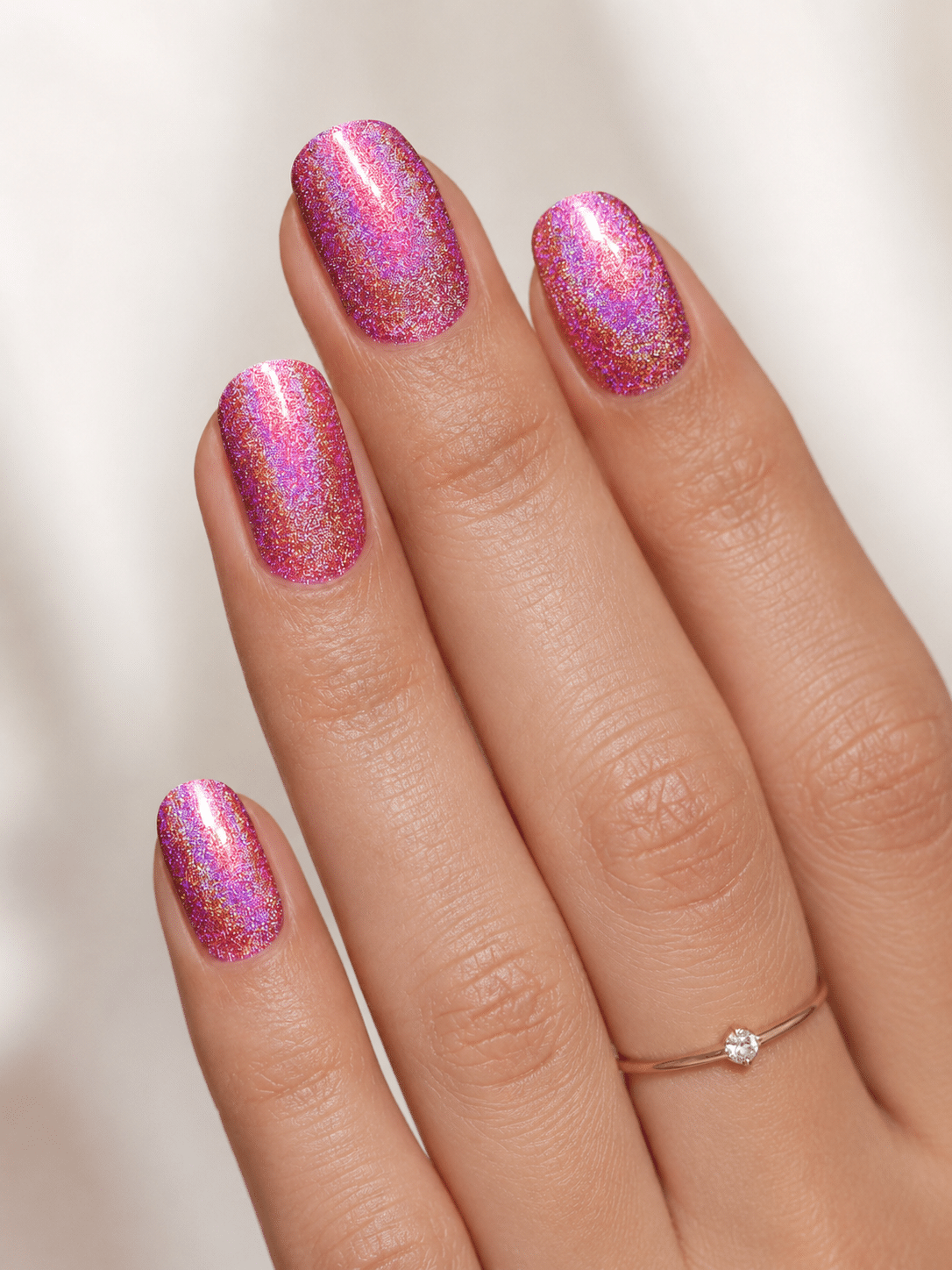 Rosy mauve holographic nails with a soft reflective sparkle