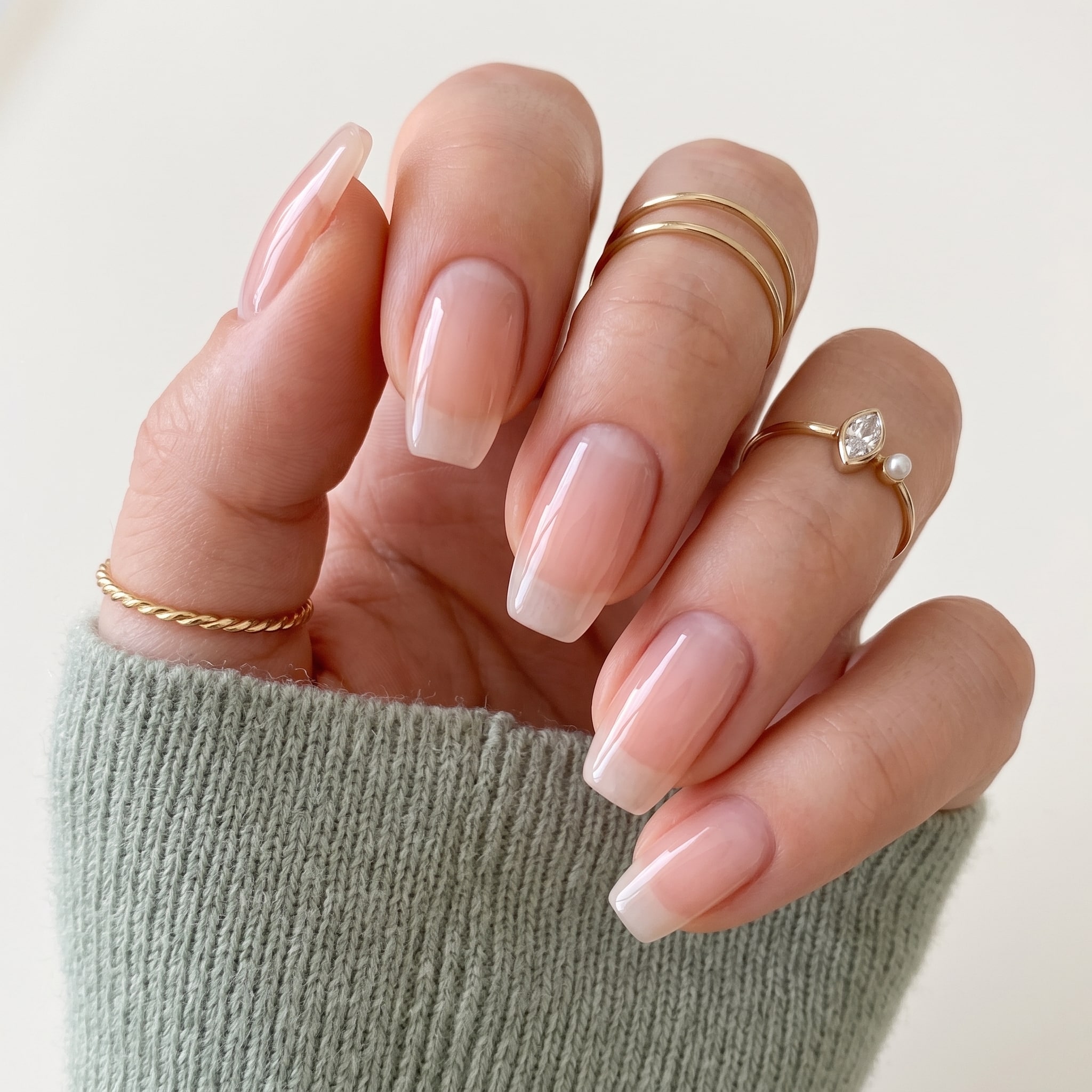 Sheer pink gel nail polish with a smooth glossy salon finish
