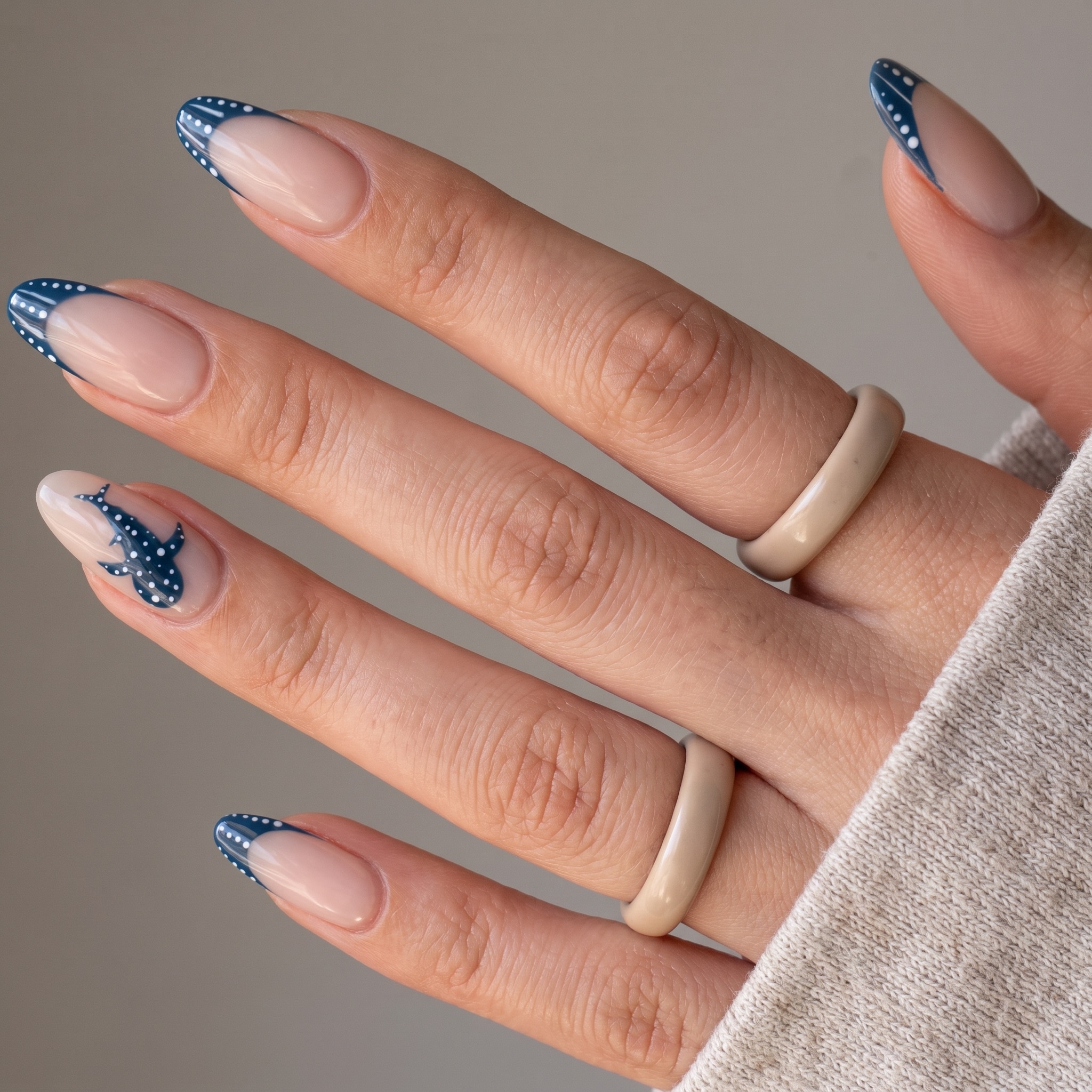 single blue ocean accent nail with dotted shark art detail
