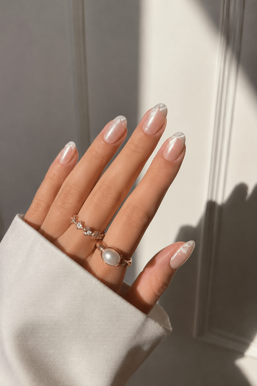 Soft off white nail polish with glossy neutral manicure finish