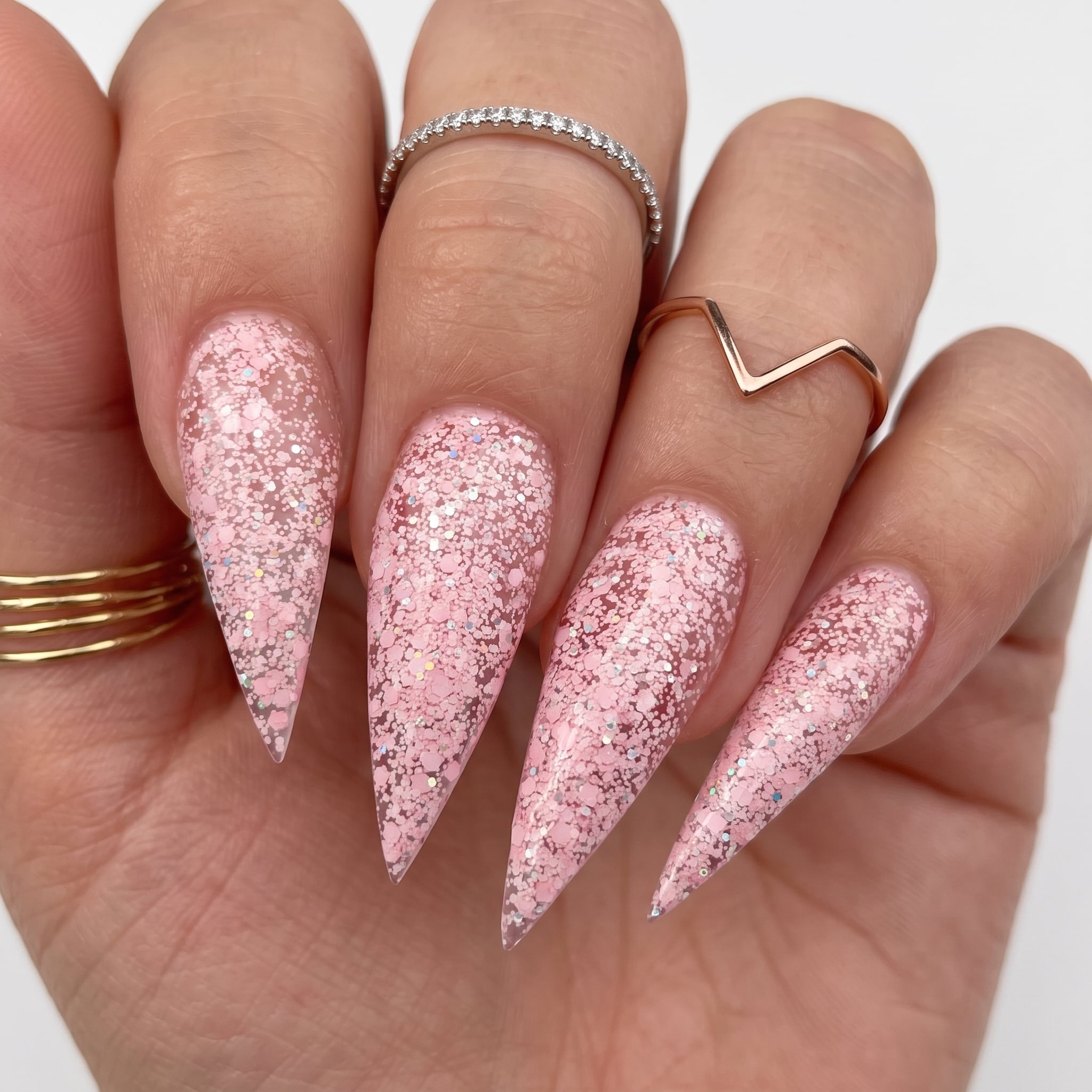 Bold fuchsia glitter nail polish with a bright sparkling finish