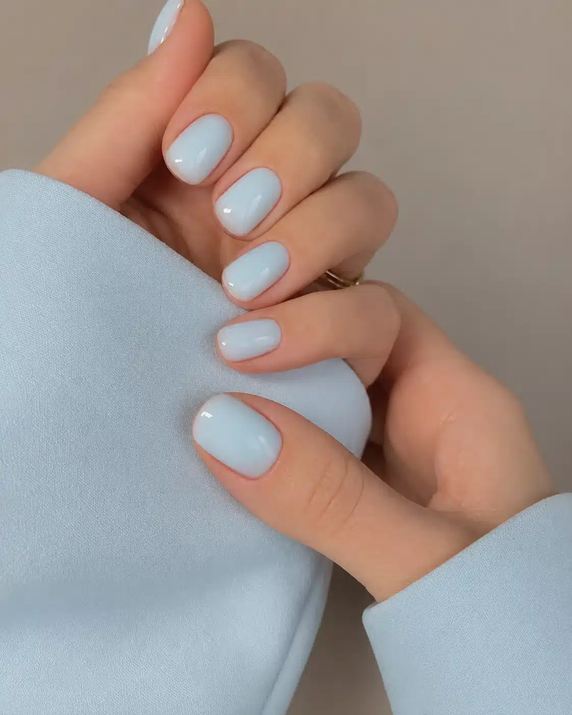 Milky Blue Nail Polish: 10 Soft Manicure Ideas to Try 11 Short milky blue nails with glossy polish