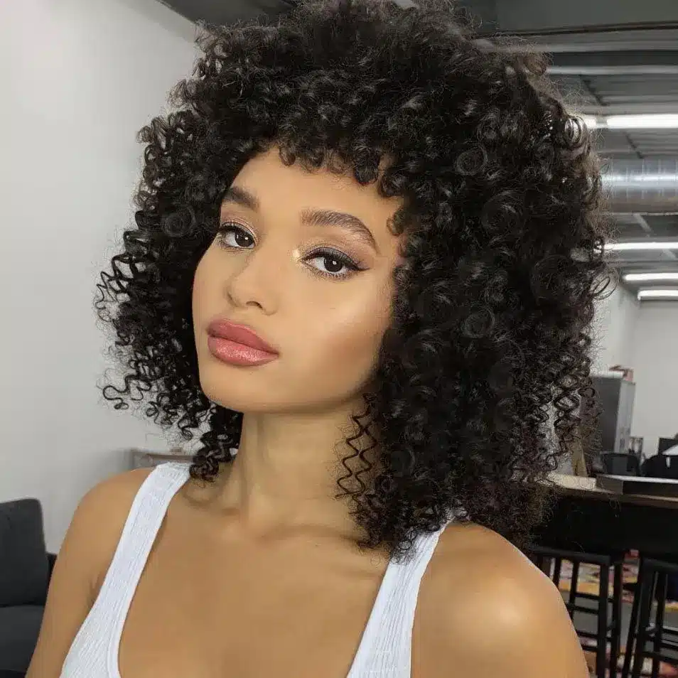 70s curly shag with voluminous layers, part of the 35 short brown hairstyles you'll be seeing everywhere