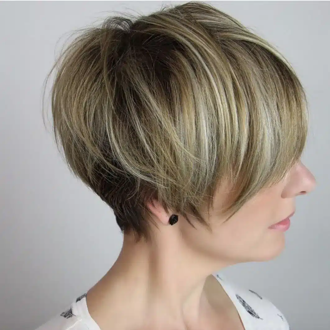 Cheek-grazing pixie cut with soft layers, one of the 35 short brown hairstyles you'll be seeing everywhere