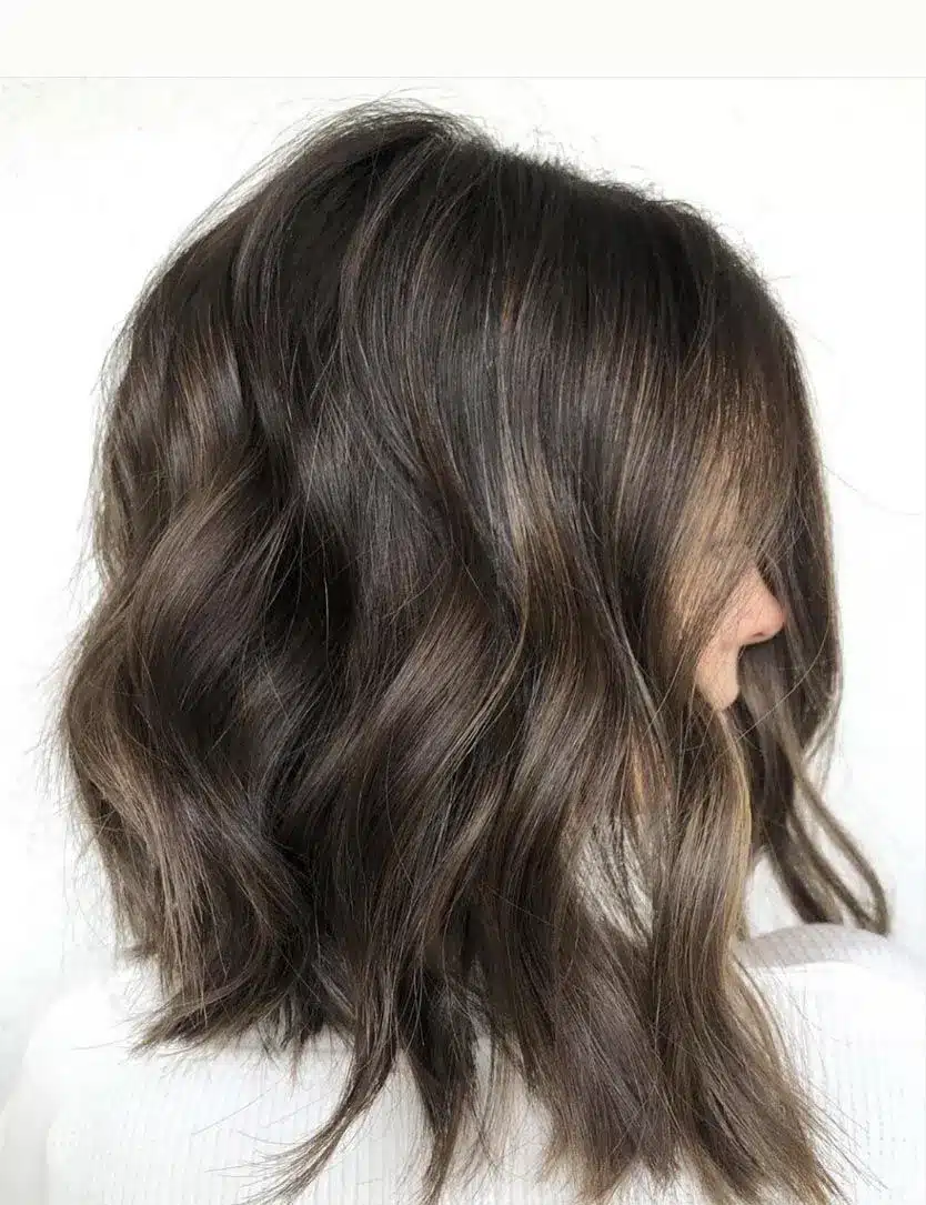 Angled lob with graduated layers, one of the 35 short brown hairstyles you'll be seeing everywhere