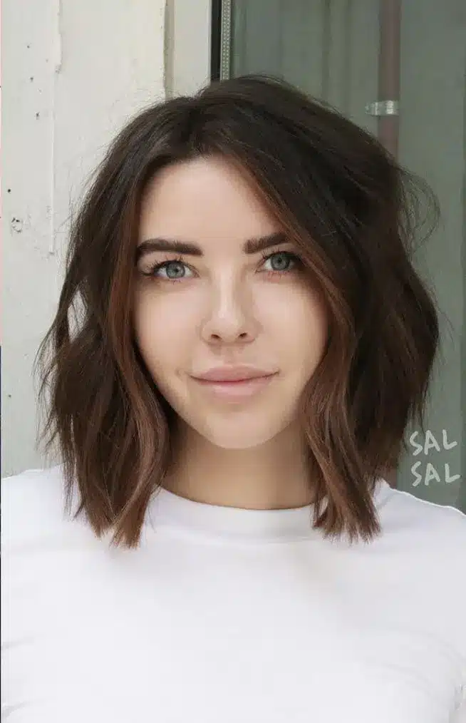 Collarbone lob with soft ends, part of the 35 short brown hairstyles you'll be seeing everywhere