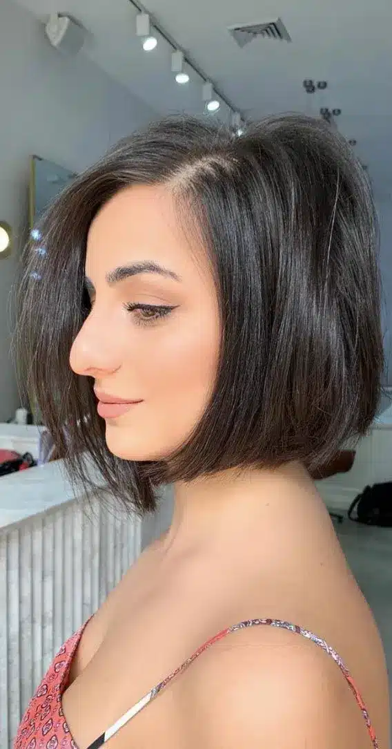 Rounded chin bob featuring soft layers, part of the 35 short brown hairstyles you'll be seeing everywhere