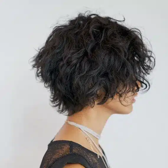 Graduated curly bob with stacked back, featured in the 35 short brown hairstyles you'll be seeing everywhere