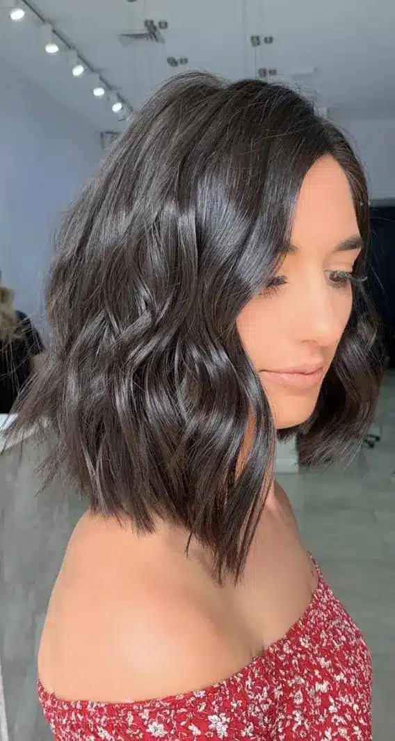 Angled shoulder cut with longer front pieces, among the 35 short brown hairstyles you'll be seeing everywhere