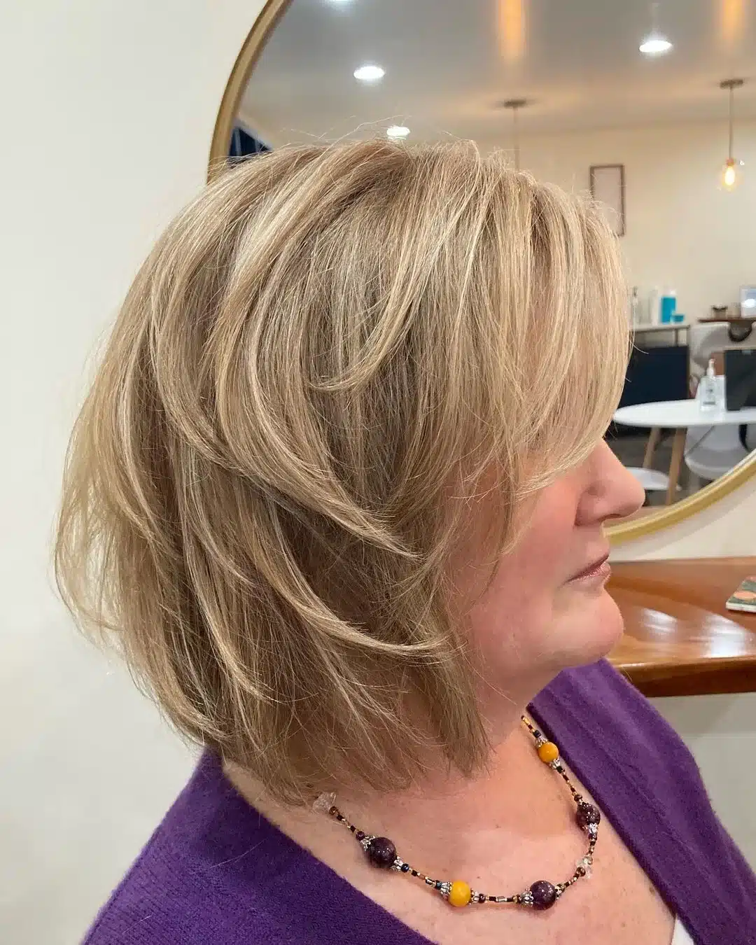 Dark blonde layered bob with bangs for thick hair