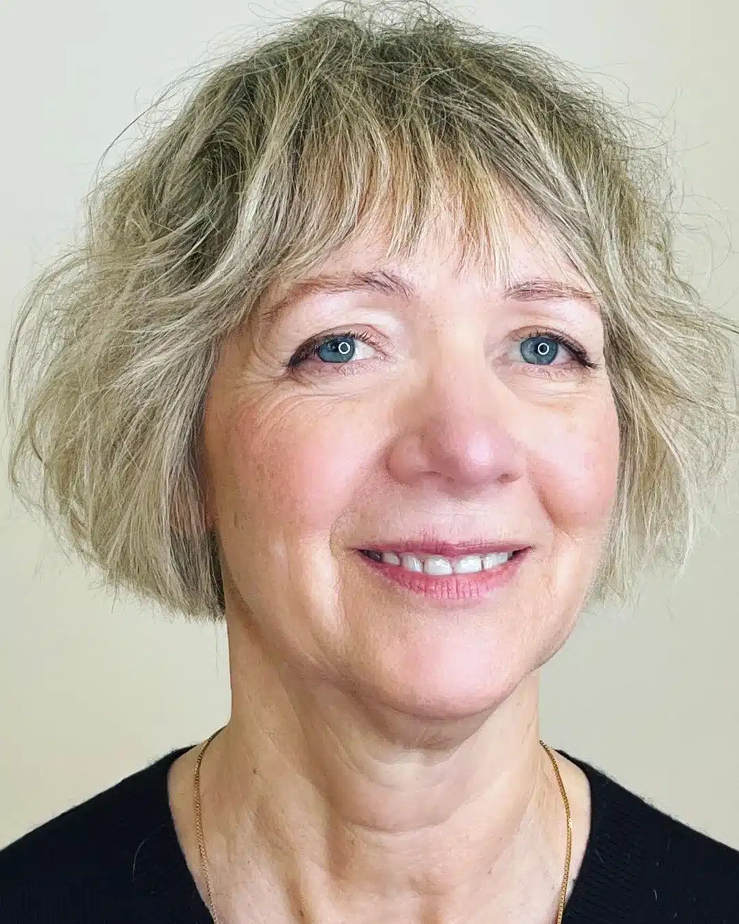 Short messy bob with short bangs for thin hair over 50
