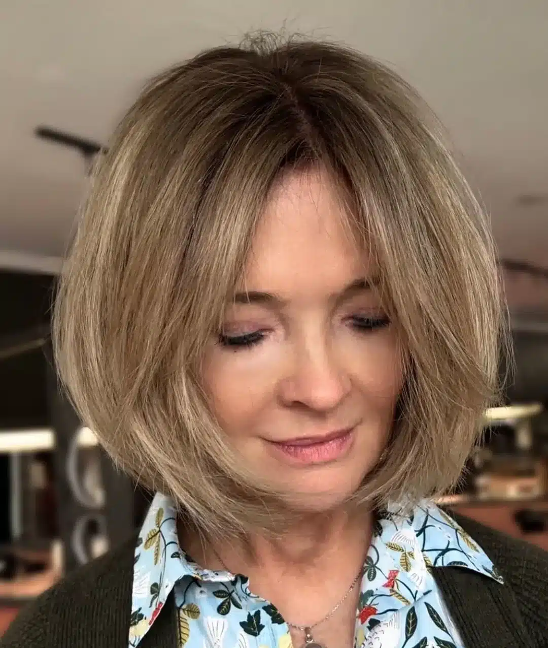 Middle part dirty blonde bob with shadow roots