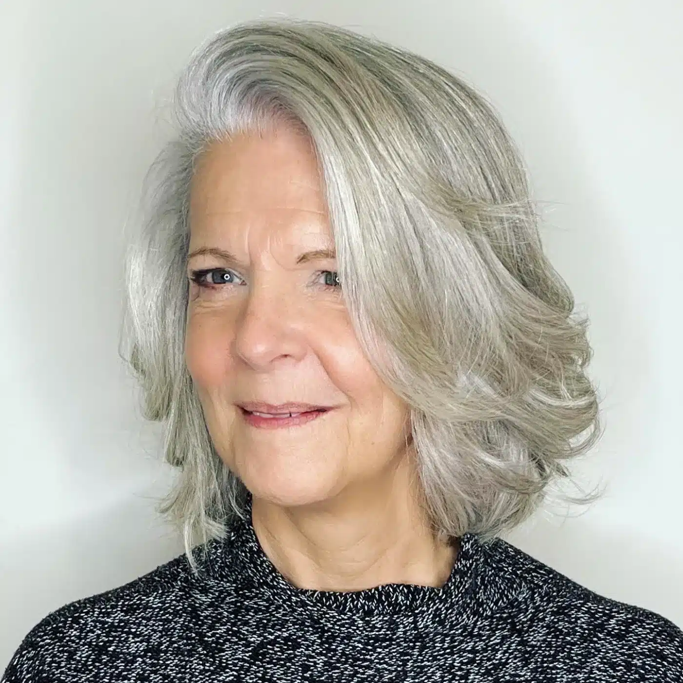 30 Trendiest Bob Haircuts for Older Women 24 Deep side part blowout bob for older women