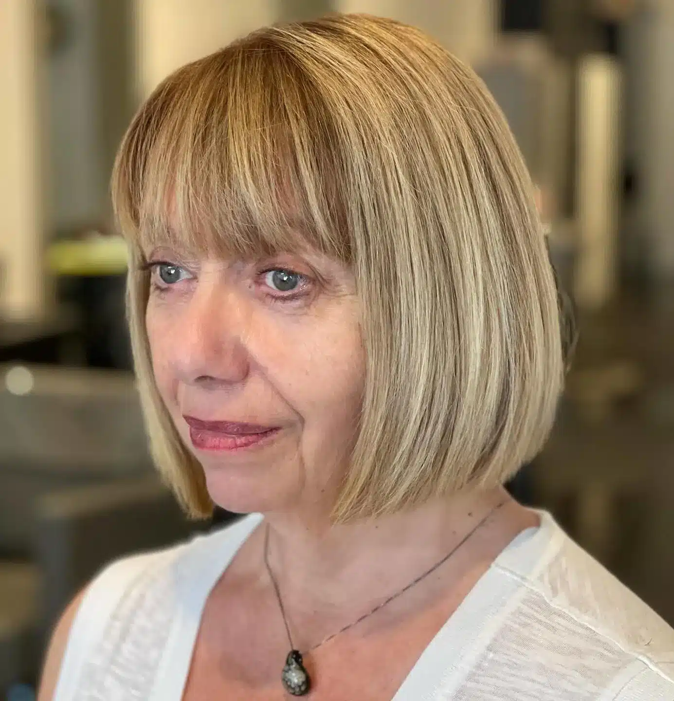 30 Trendiest Bob Haircuts for Older Women 26 Bob with blunt bangs and dimensional highlights