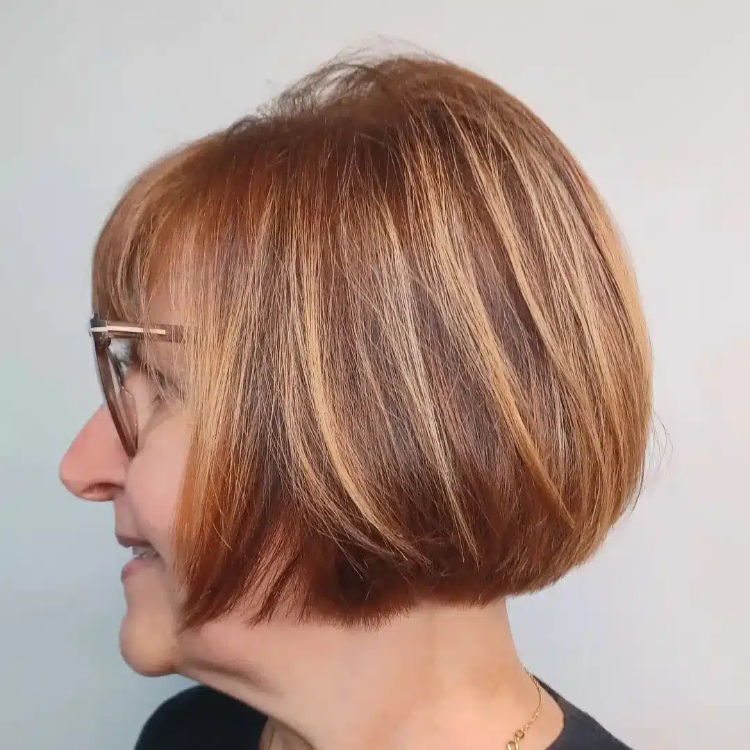 Short red bob with highlights with nape undercut