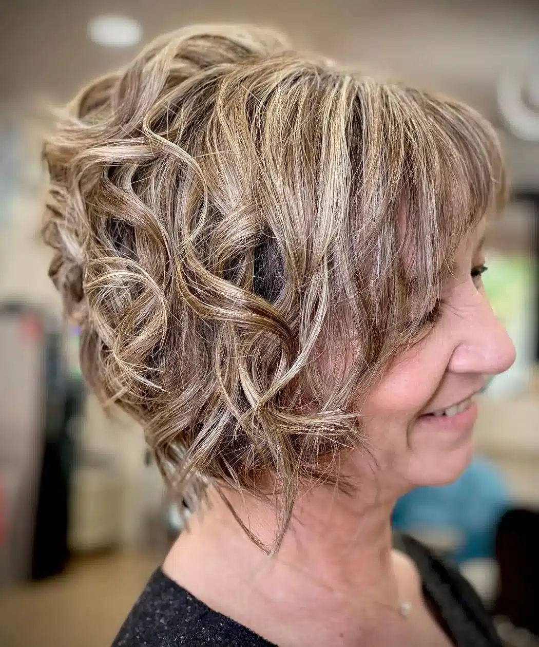 Short curled a line bob with bangs